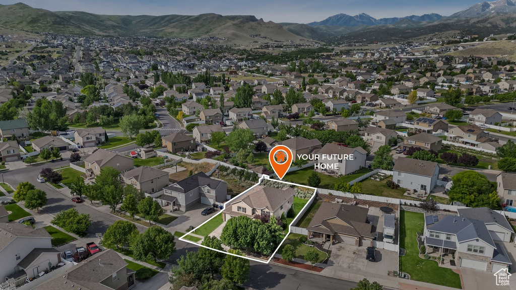 View of property location featuring property boundaries highlighted, nearby suburban area, and a mountainous background