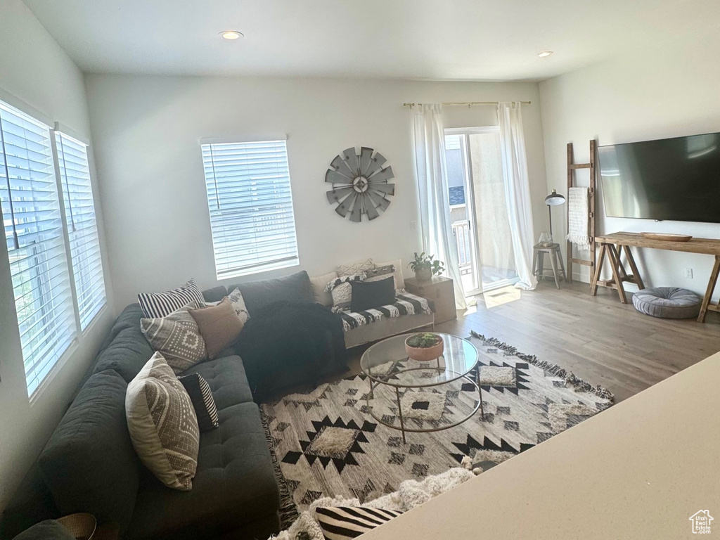 Living area with recessed lighting and wood finished floors