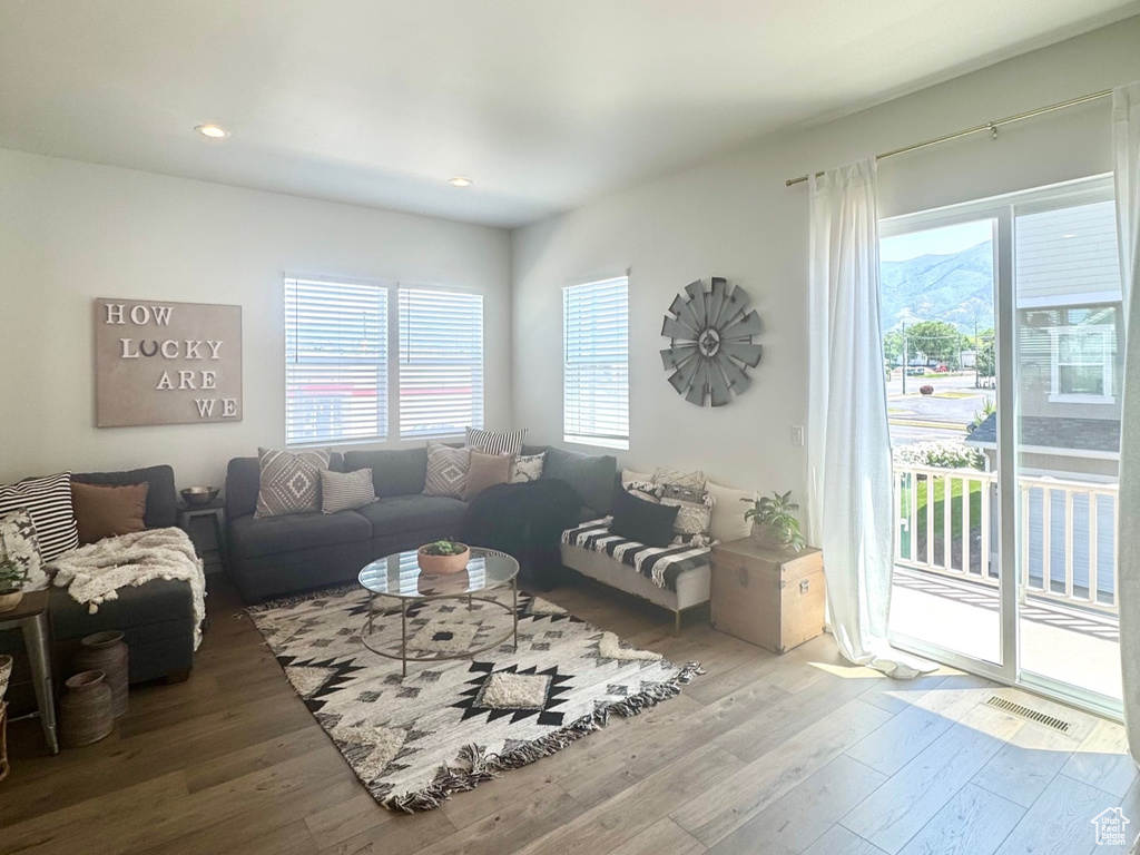 Living room featuring hardwood / wood-style floors and recessed lighting