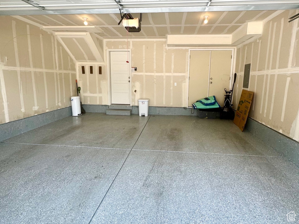 Garage featuring a garage door opener