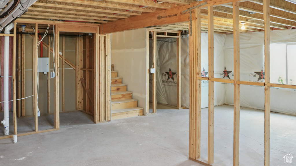 Unfinished basement featuring stairs