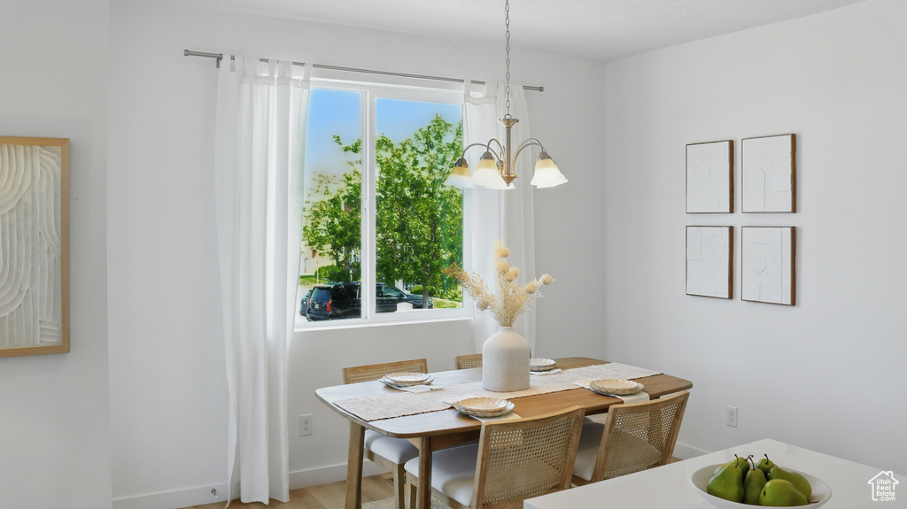 Dining space with a chandelier