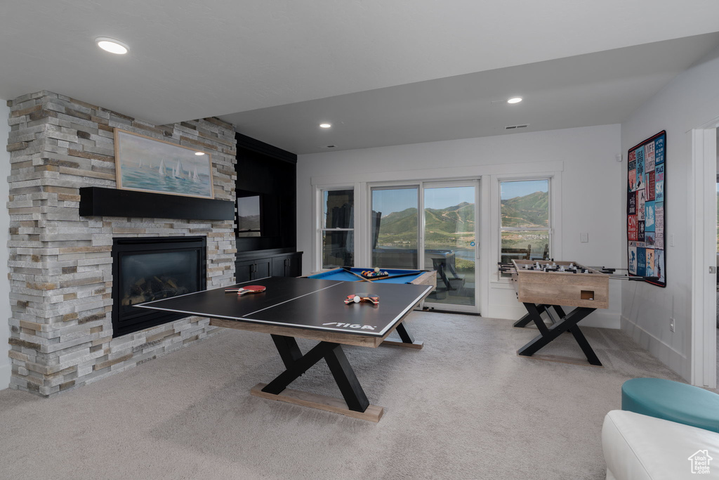 Playroom featuring carpet, a fireplace, and recessed lighting
