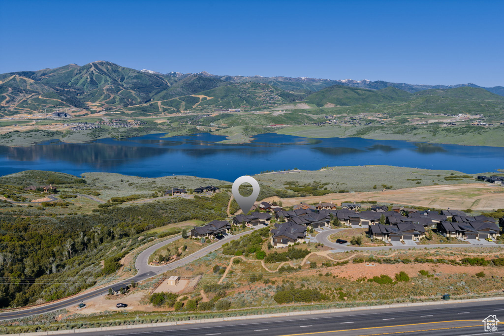 View of property location with a water and mountain view