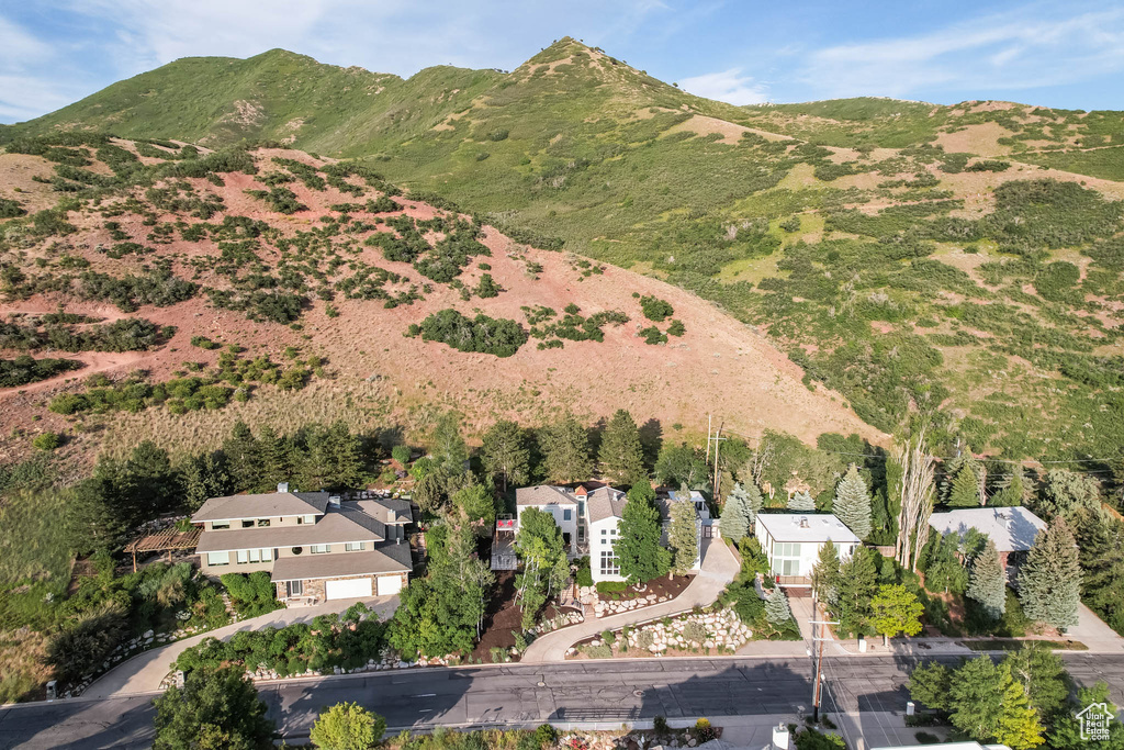 Aerial view of property and surrounding area featuring mountains