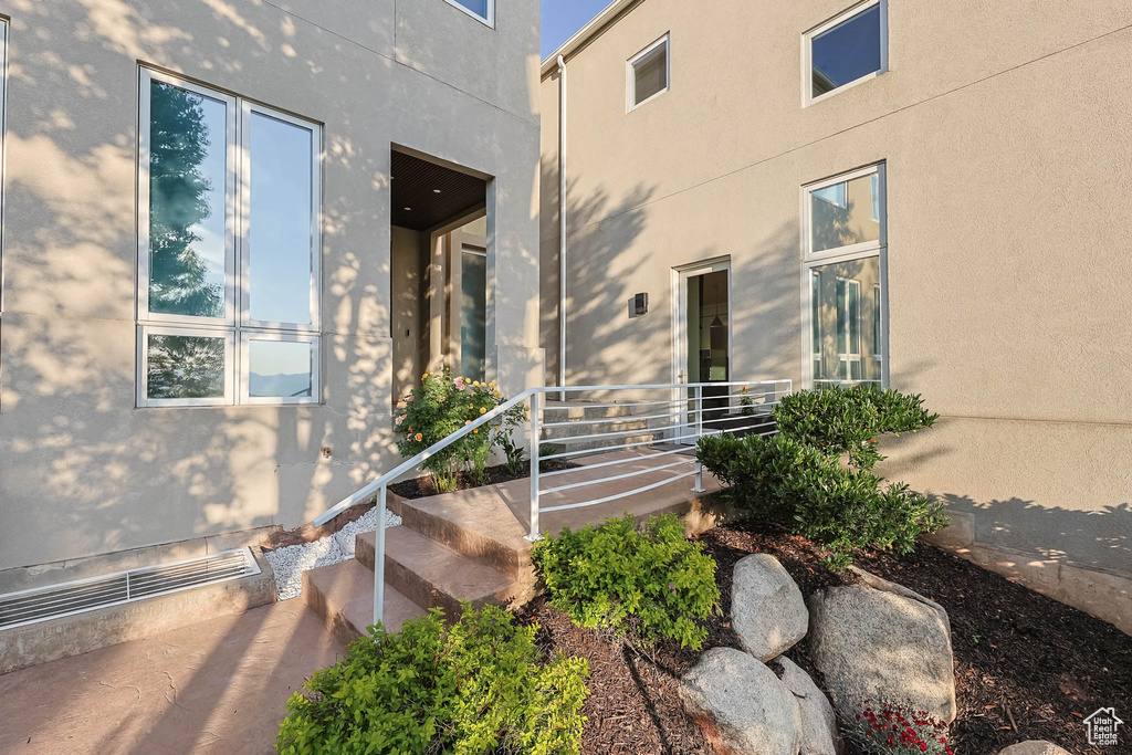 Doorway to property with stucco siding