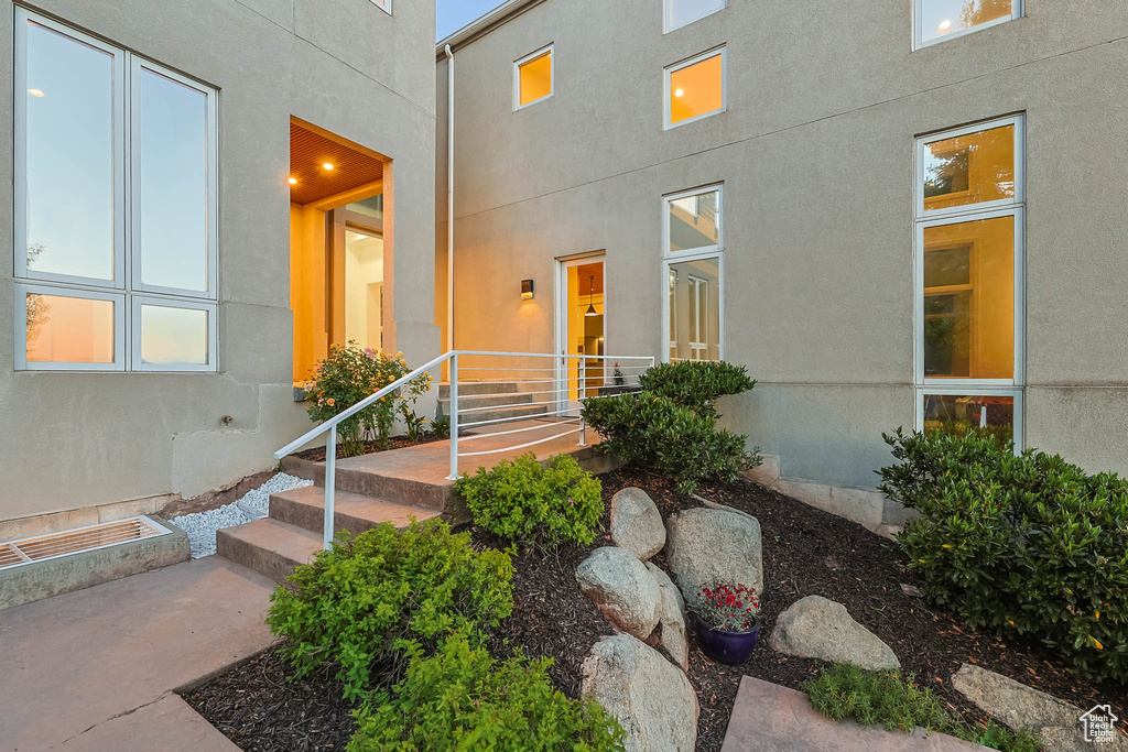 Property entrance featuring stucco siding