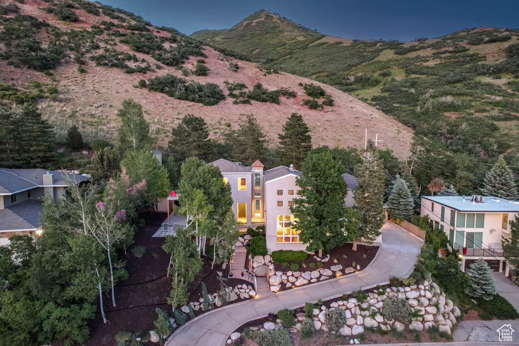 Aerial view of property and surrounding area featuring mountains