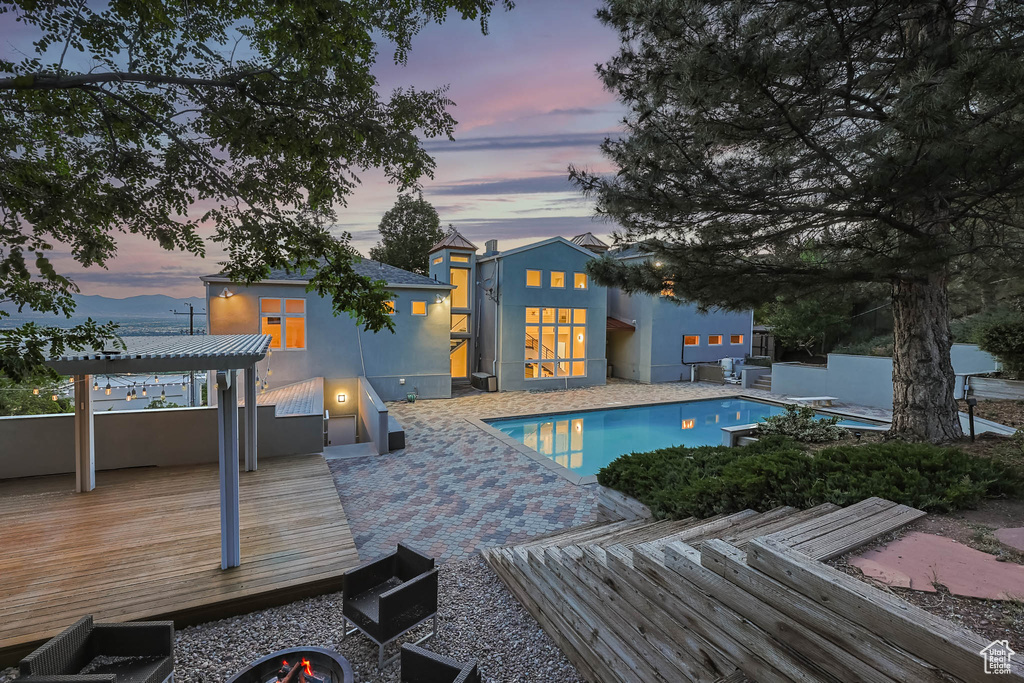 Outdoor pool featuring a deck