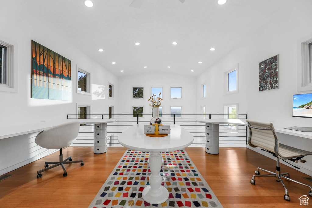 Office area with recessed lighting, wood finished floors, and lofted ceiling