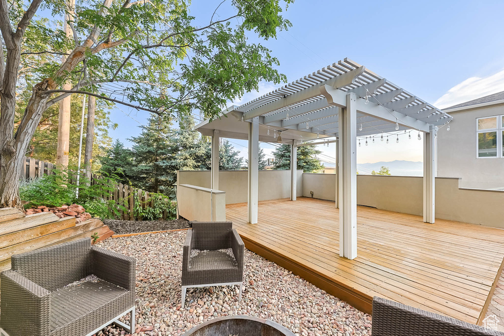 Deck featuring a pergola