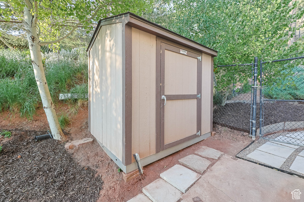 View of shed featuring a gate