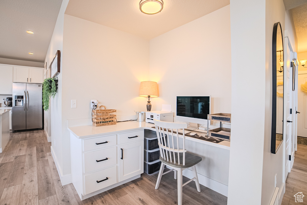 Office featuring light wood-style flooring, recessed lighting, and baseboards