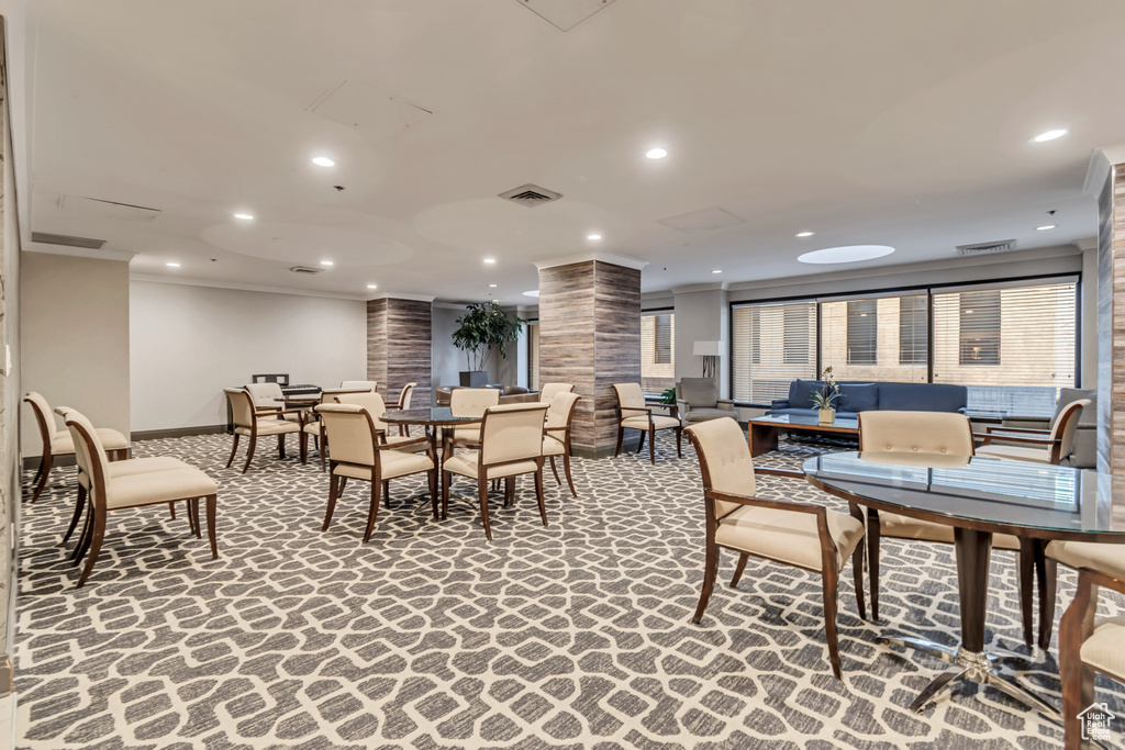 Dining area featuring ornate columns, ornamental molding, baseboards, recessed lighting, and carpet floors