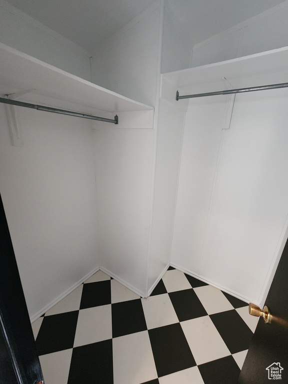 Walk in closet featuring tile patterned floors
