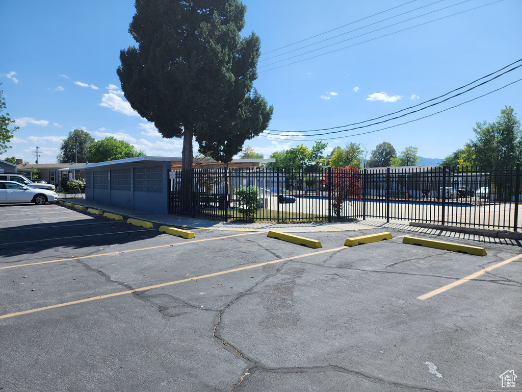 Uncovered parking lot with a swimming pool