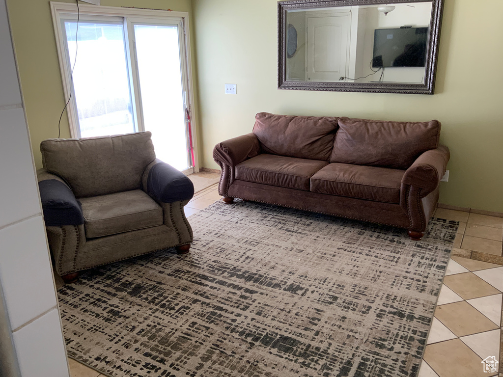 Living area featuring light tile patterned floors