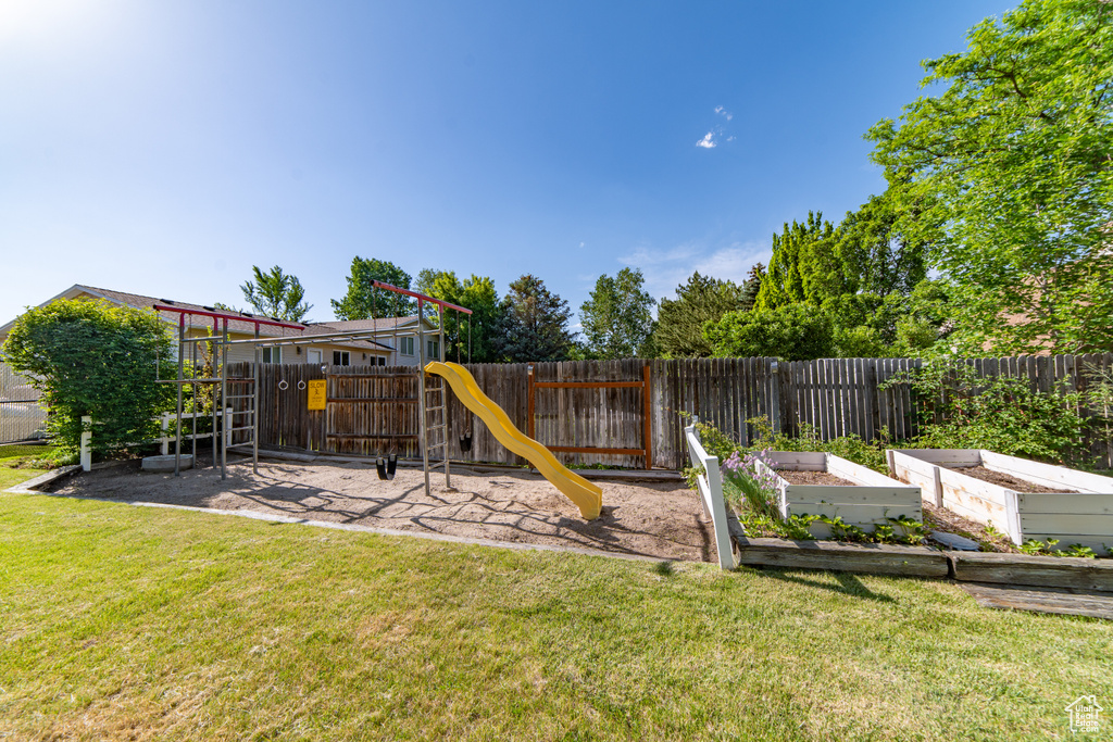 View of playground with a garden