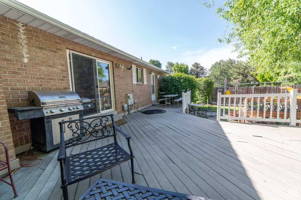 Deck with area for grilling and outdoor dining area
