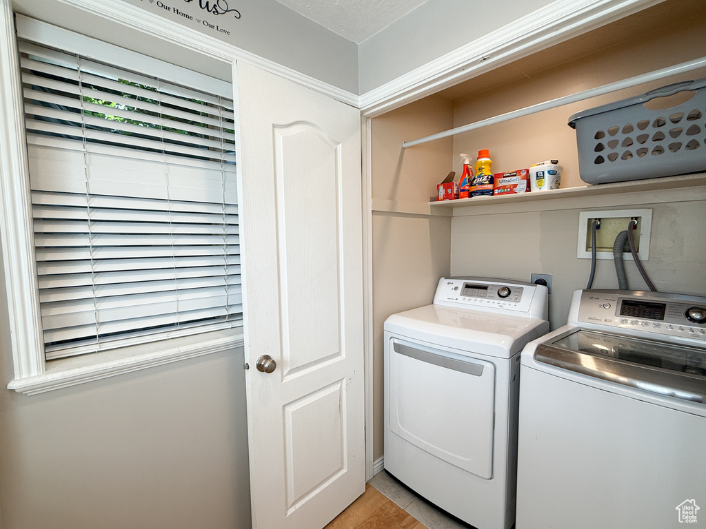 Laundry area featuring separate washer and dryer