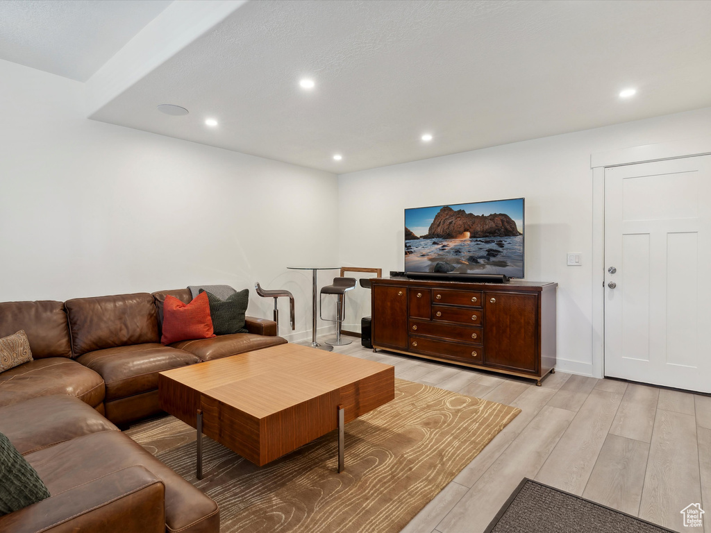 Living area featuring recessed lighting, light wood-type flooring, and baseboards
