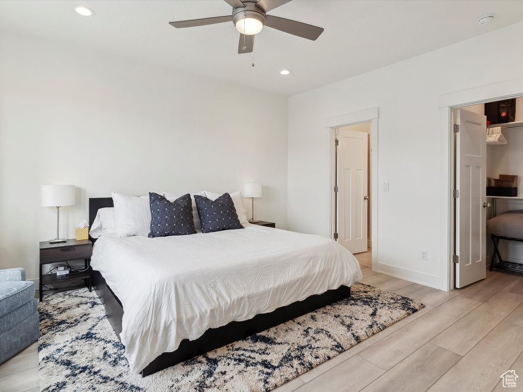 Bedroom featuring light wood-type flooring, recessed lighting, baseboards, and a ceiling fan