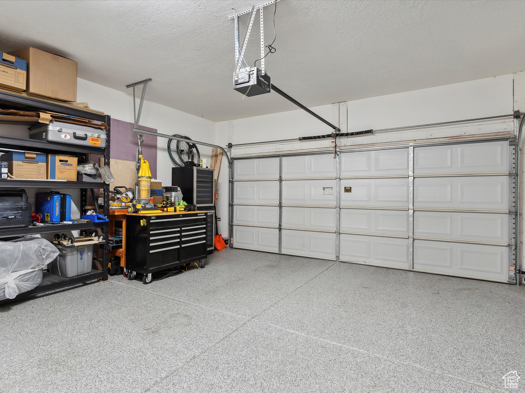 Garage featuring a garage door opener