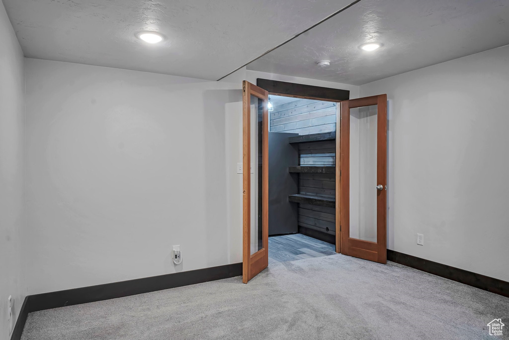 Unfurnished bedroom with carpet flooring and baseboards