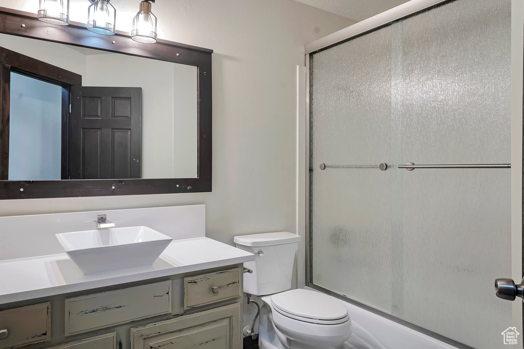 Full bathroom with vanity and toilet