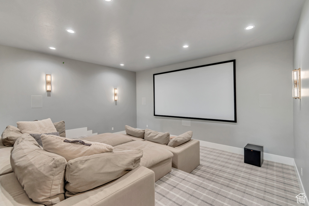 Cinema room featuring recessed lighting, light carpet, and baseboards