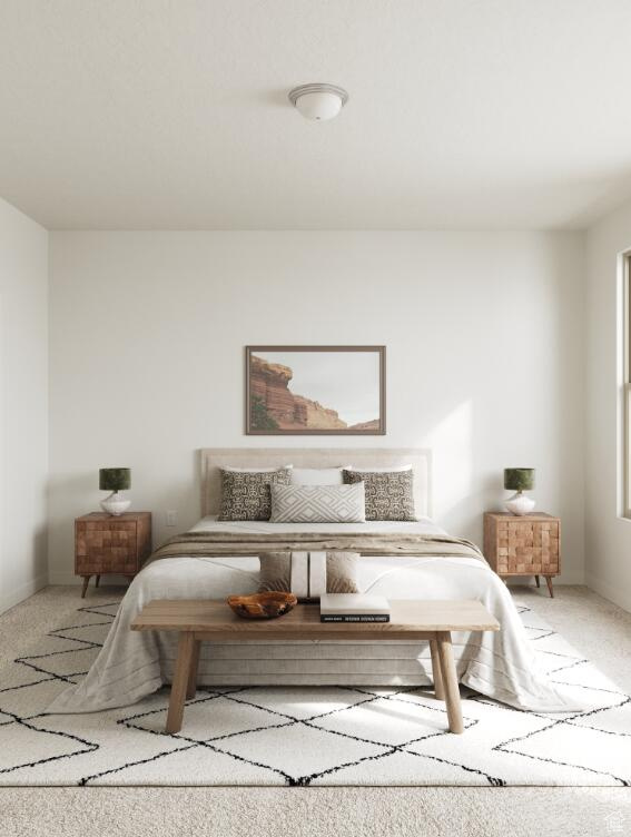 Bedroom featuring carpet floors and baseboards