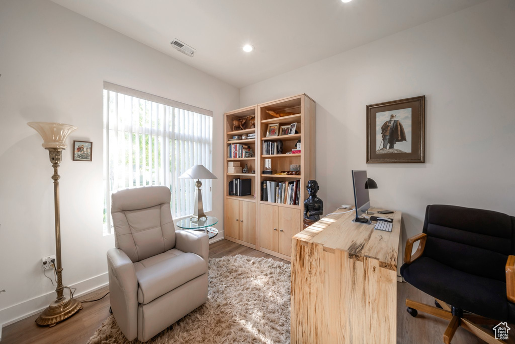 Home office featuring wood finished floors, baseboards, and recessed lighting