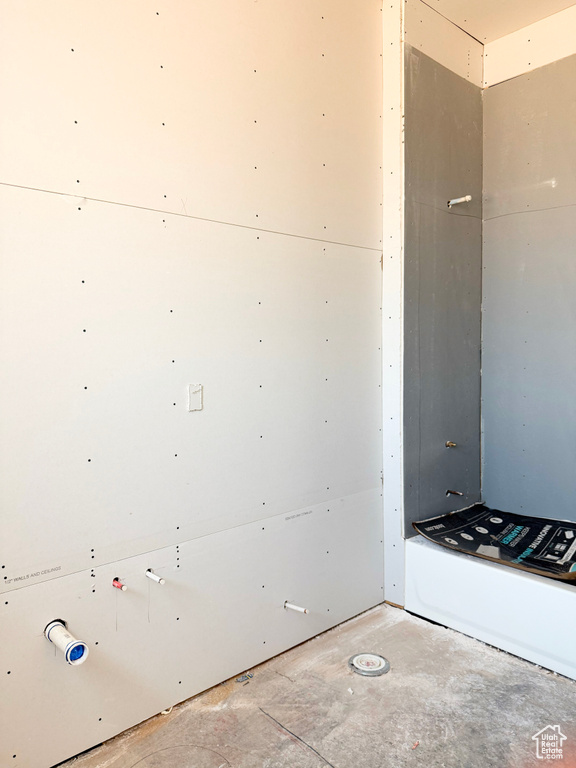 Bathroom featuring concrete flooring