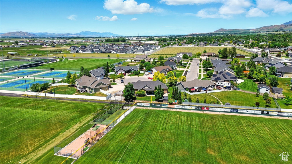 Aerial view of residential area featuring a mountainous background