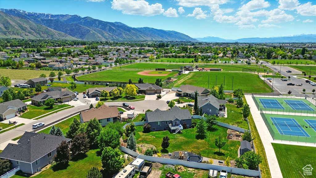 Aerial view of residential area featuring mountains