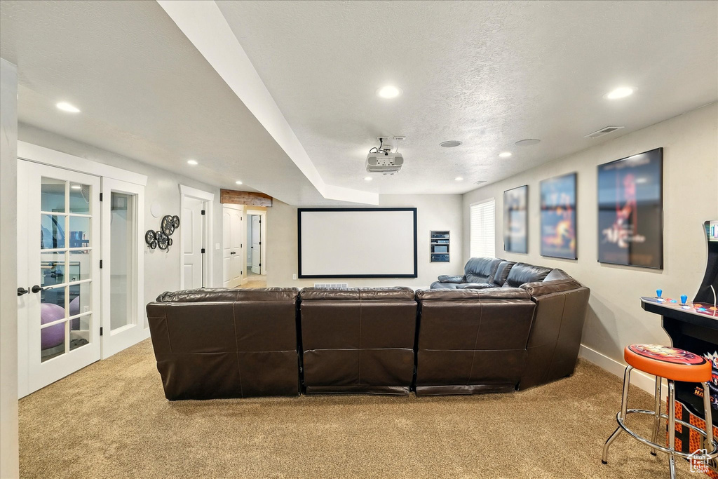Home theater room with carpet flooring, recessed lighting, baseboards, and french doors