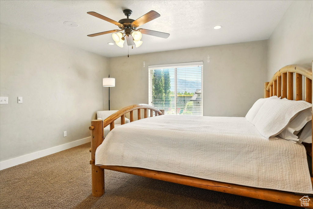 Bedroom featuring carpet flooring, baseboards, recessed lighting, and ceiling fan