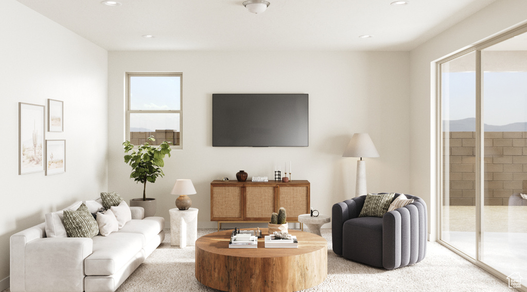 Living room with light carpet and recessed lighting