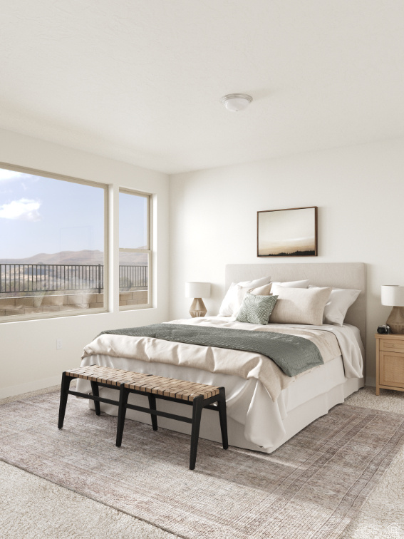 Bedroom with light colored carpet