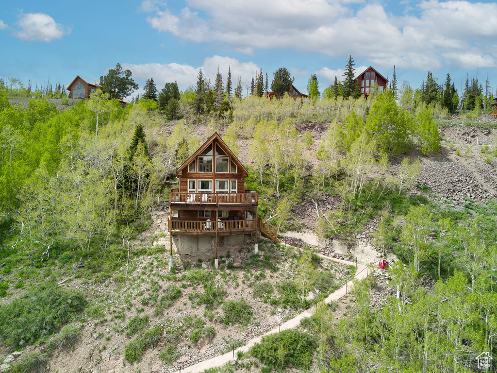 Rear view of house with a wooden deck