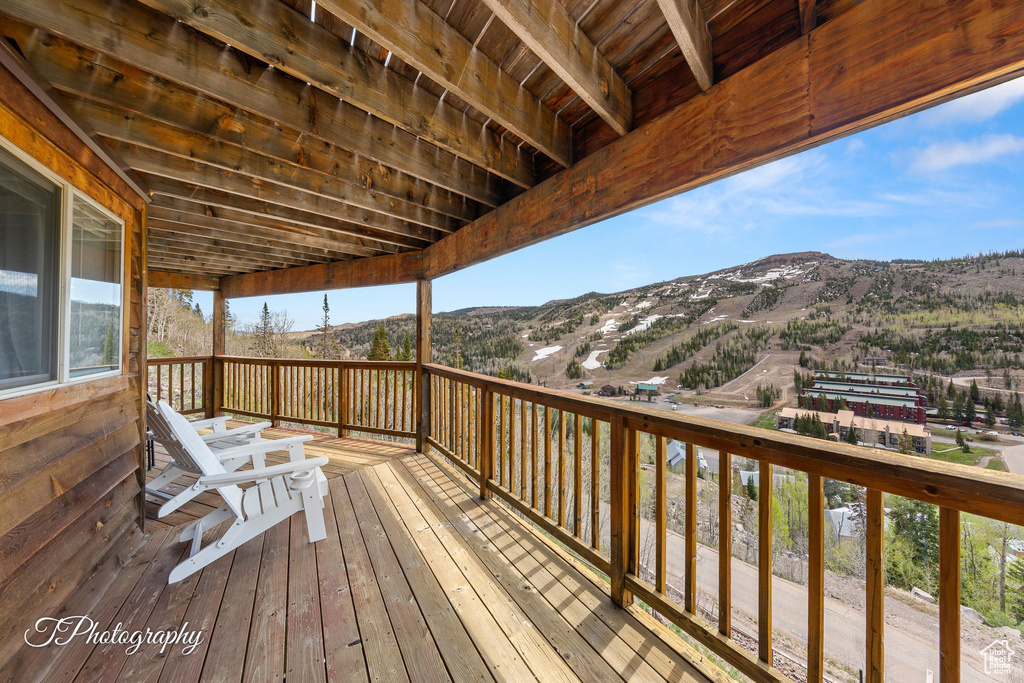 Wooden deck featuring a mountain view