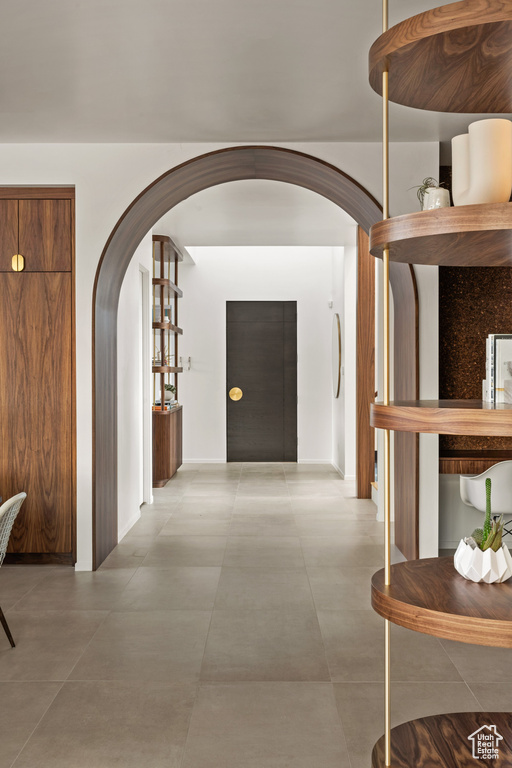 Hallway featuring arched walkways