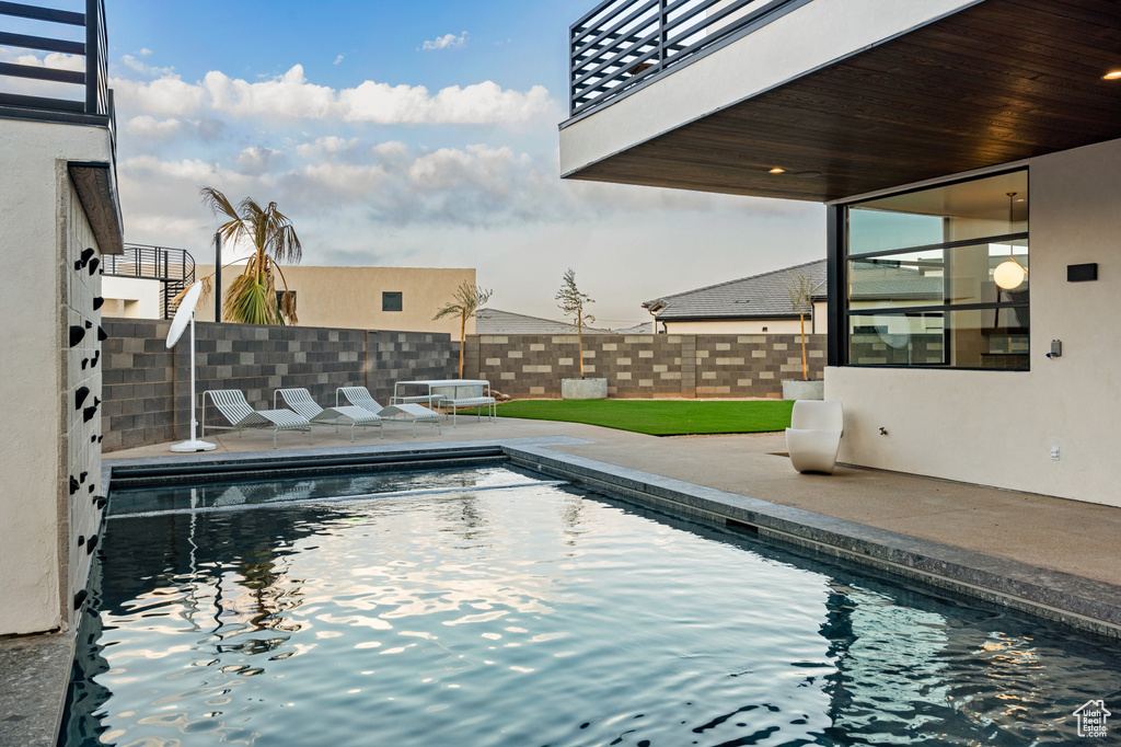 View of swimming pool featuring a patio area
