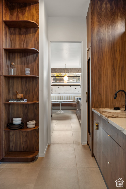 Hallway featuring a sink