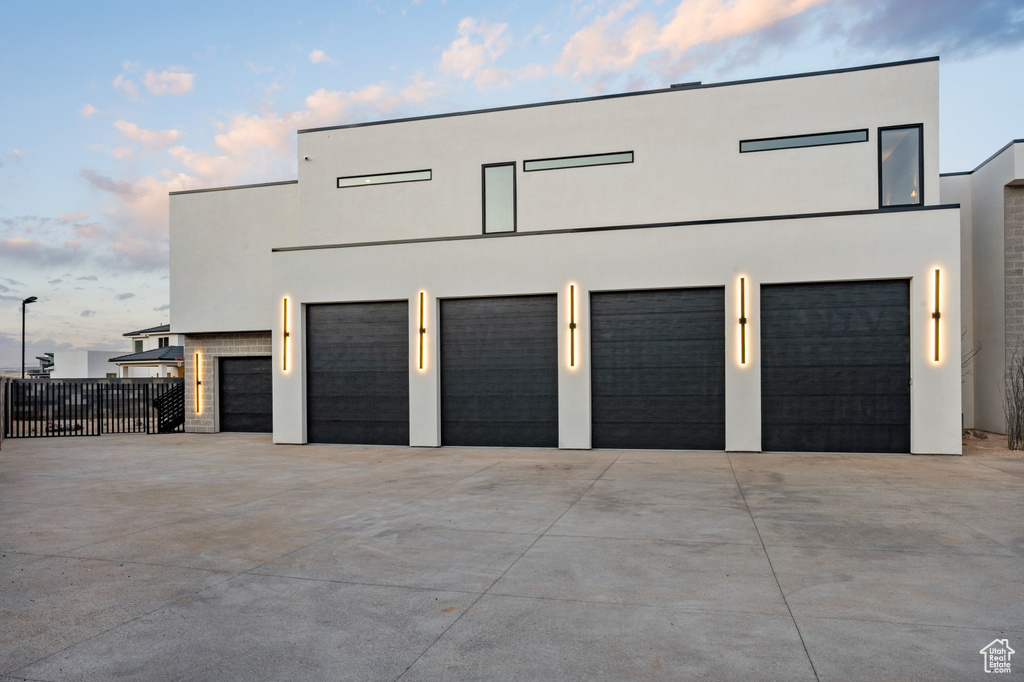 Garage featuring concrete driveway