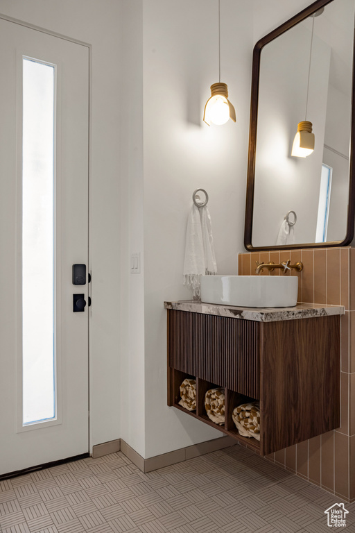 Bathroom featuring vanity and baseboards