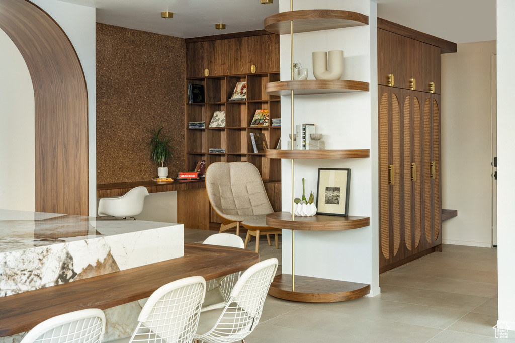 Tiled office space featuring arched walkways