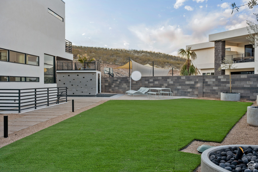 View of yard with a patio area and a fire pit