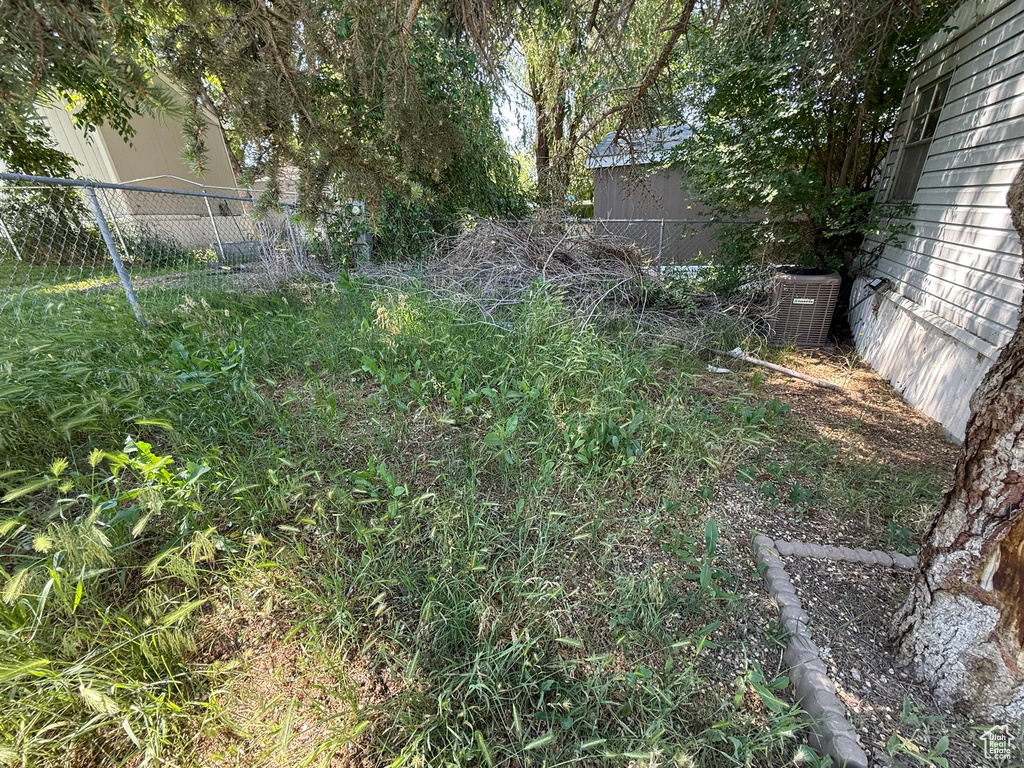 View of yard featuring cooling unit