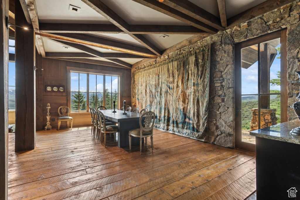 Dining room featuring hardwood / wood-style floors and beam ceiling